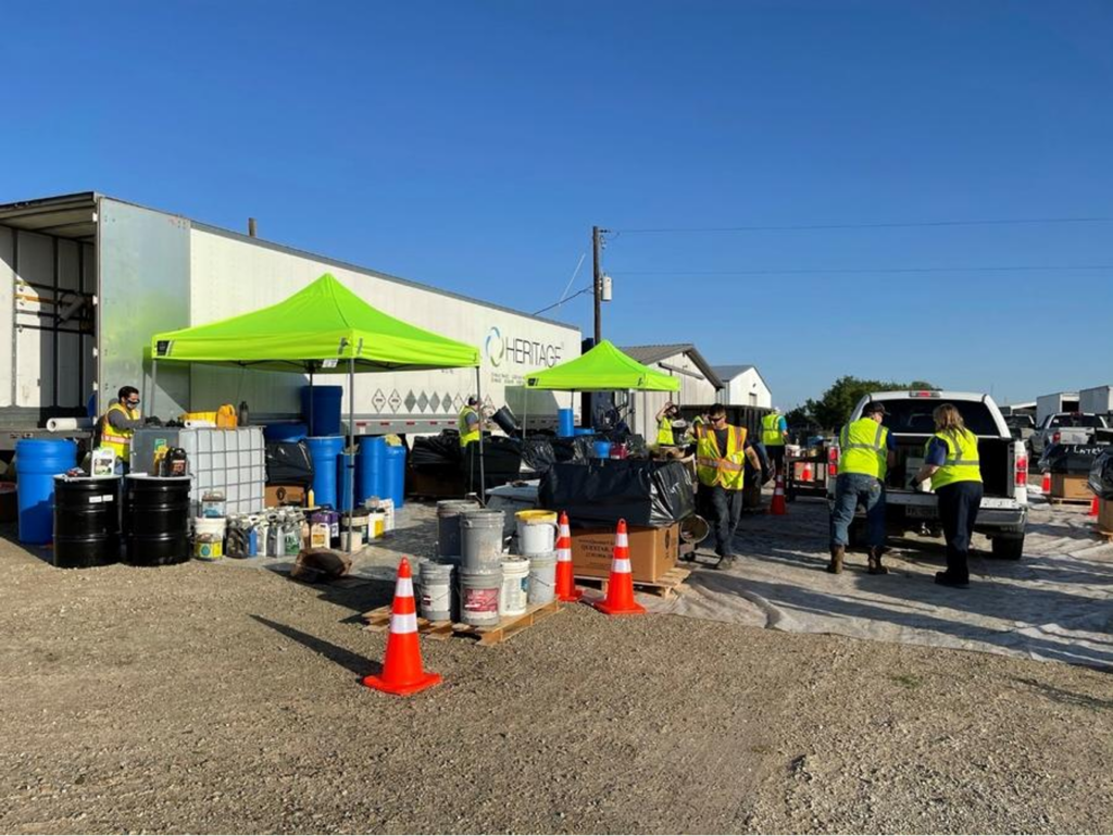 A team of volunteers collects household hazardous waste products from constituents truck.