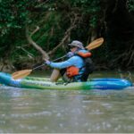 Derek Boese kayaks along the Mission Reach