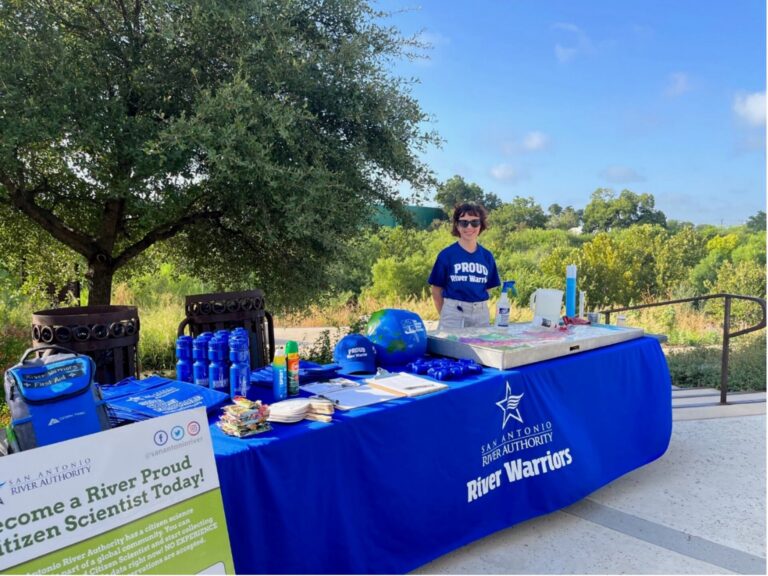 Amanda at the River Warrior Table set up