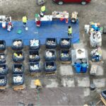 Aerial view of trash bins filled with items from a household hazardous waste event