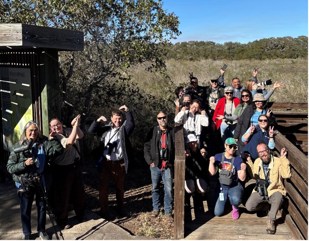 A group of people gathered near the San Antonio Bay