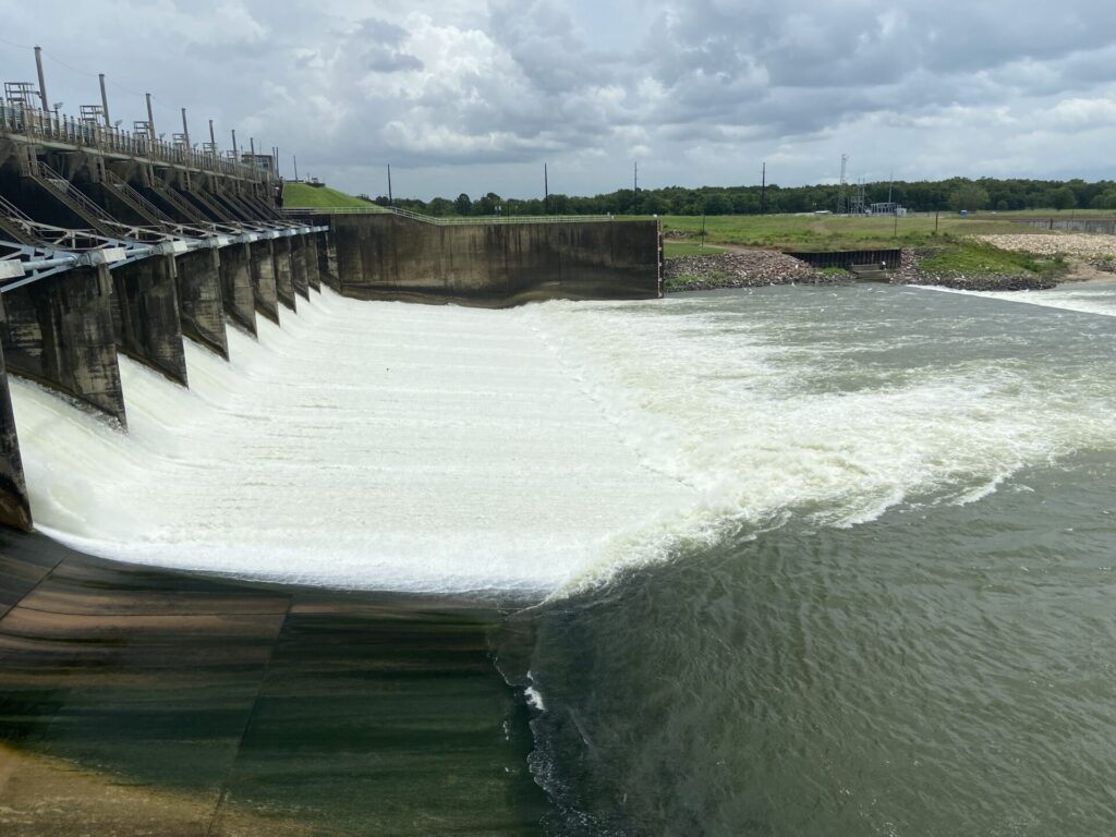 The spillway gates at Lake Livingston releasing Trinity River flood waters in 2020.